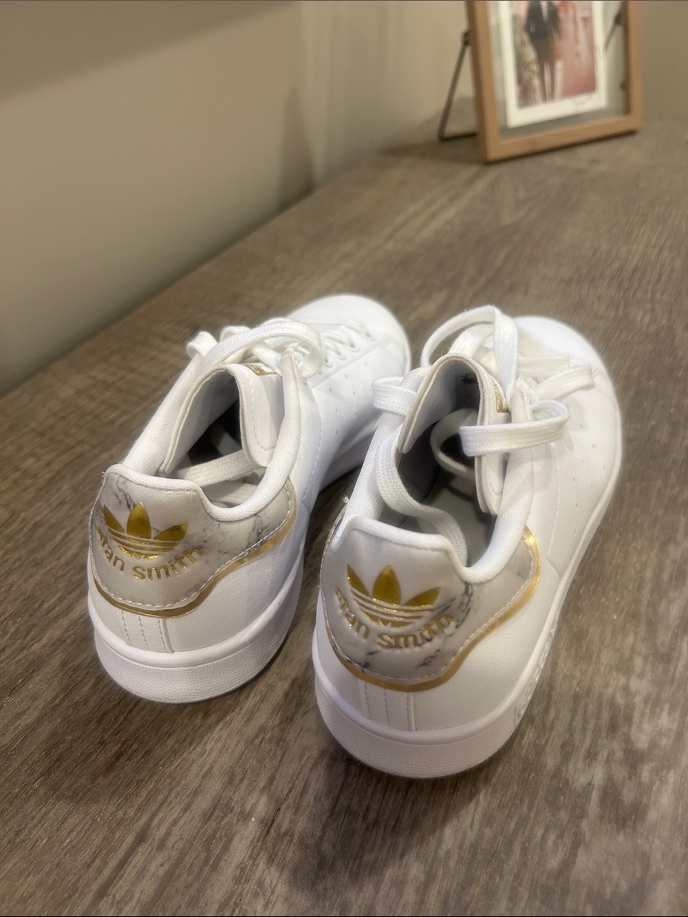 adidas women’s  Stan Smith White Sneakers with Gold Marble Heel Accent